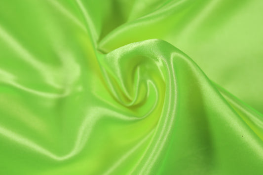 Glänzender Satinstoff in frischem Limonengrün