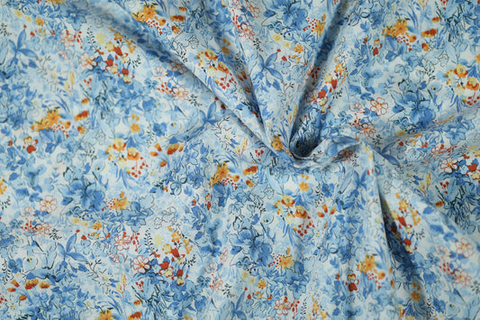 Hochwertiger Stretchstoff mit Blumenmuster in Himmelblau mit Orange – perfekt für Nähen und Design