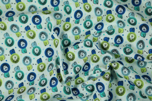 Elastischer Baumwollstoff Löwenparade – Türkis mit weichem Griff