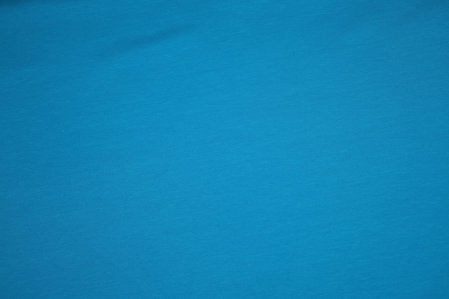 Türkisblau Baumwolljersey - Detailbild der elastischen Stoffqualität