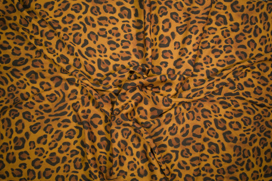 Satin Viskose Stoff mit klassischem Leopardenmuster in Senfgelb und Braun