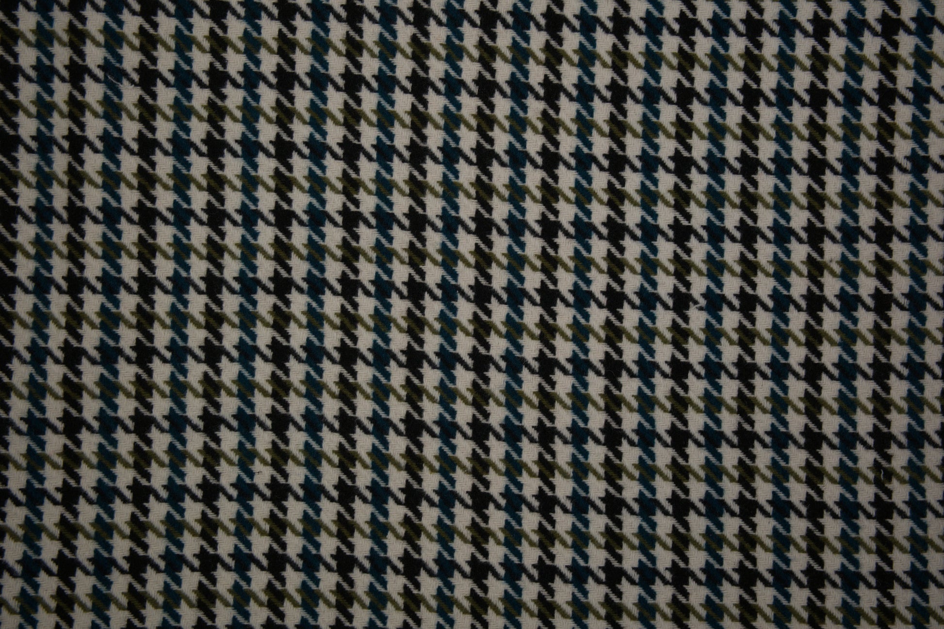 Klassischer Hahnentritt Wollstoff in Grün Schwarz – detailreiche Nahaufnahme