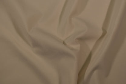 Möbelstoff in Uni-Creme mit glatter, feiner Struktur Detailaufnahme der Stoffstruktur