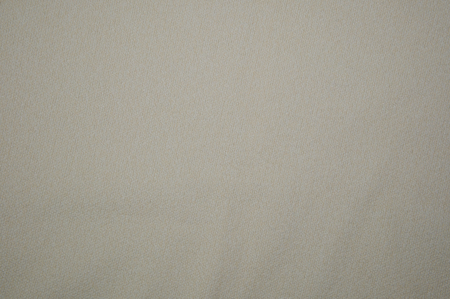 Heller Bouclé Möbelstoff in Creme – strukturierter Polsterstoff für moderne Wohnräume Detailaufnahme der Stoffstruktur