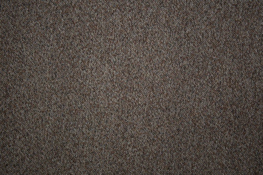 Bouclé Möbelstoff in naturfarbener Beige-Grau-Melange mit strukturierter Oberfläche Detailaufnahme der Stoffstruktur