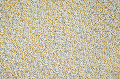 Floraler Baumwoll-Stretchstoff in Goldene Wiesenblumen – ideal für Bekleidung und kreative Projekte