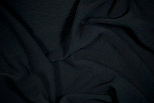 Schwarzer Stoff für Business- und Abendmode
