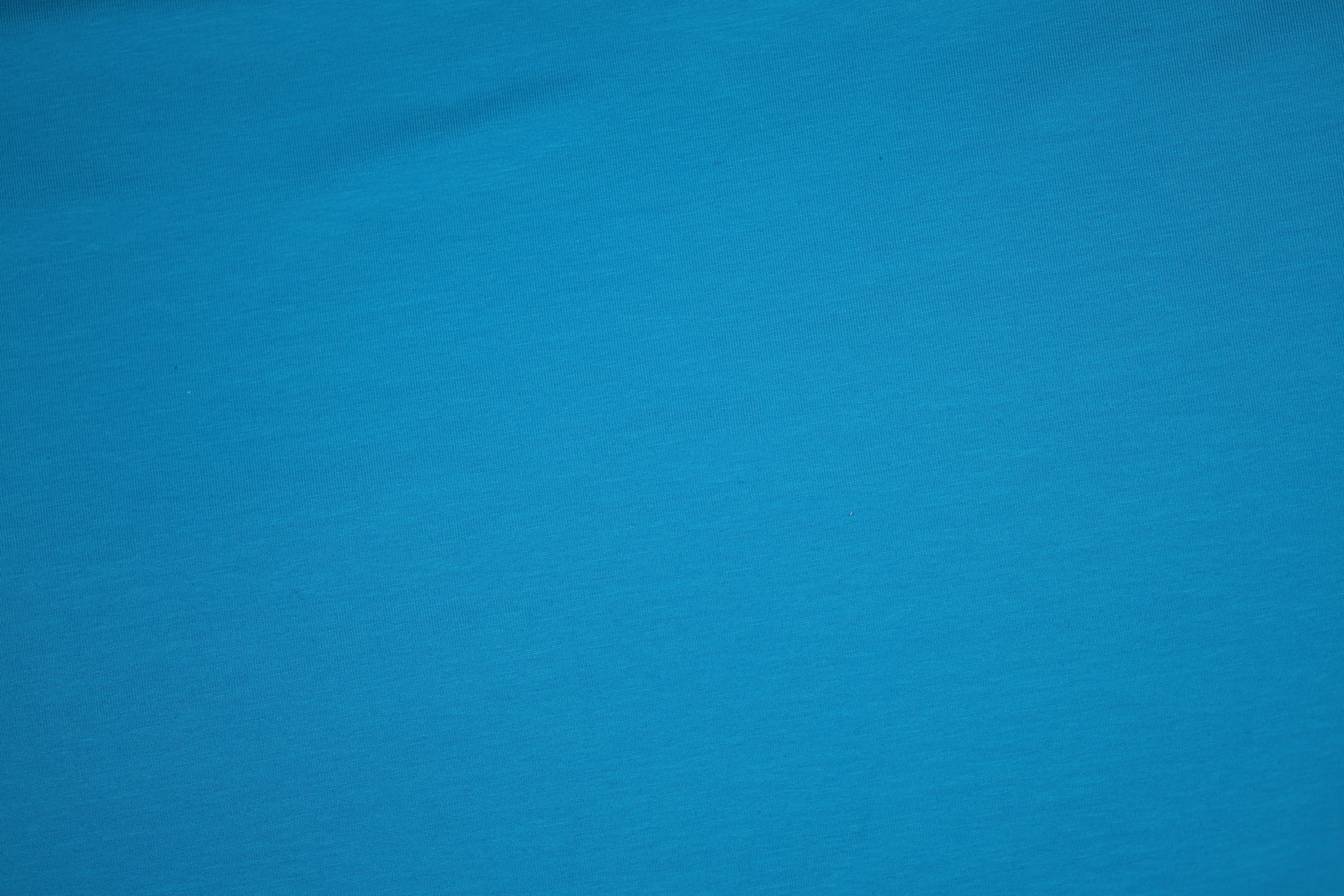 Türkisblau Baumwolljersey - Detailbild der elastischen Stoffqualität