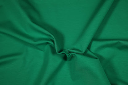 Kräftiger Baumwolljersey in Grasgrün – ideal für Sportmode