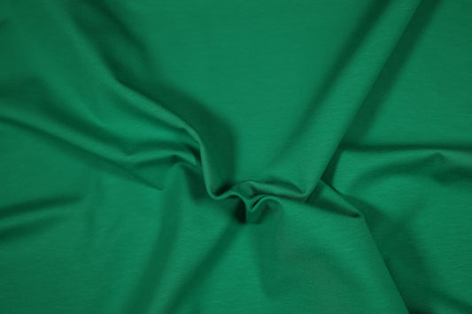 Kräftiger Baumwolljersey in Grasgrün – ideal für Sportmode